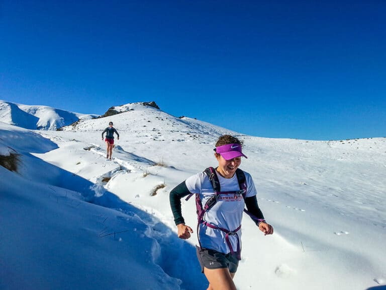 Running in deep snow across the saddle from Pinnacles to Woolshed.