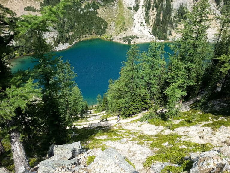 Switchbacks on the big descent towards the blue of Lake Agnes.