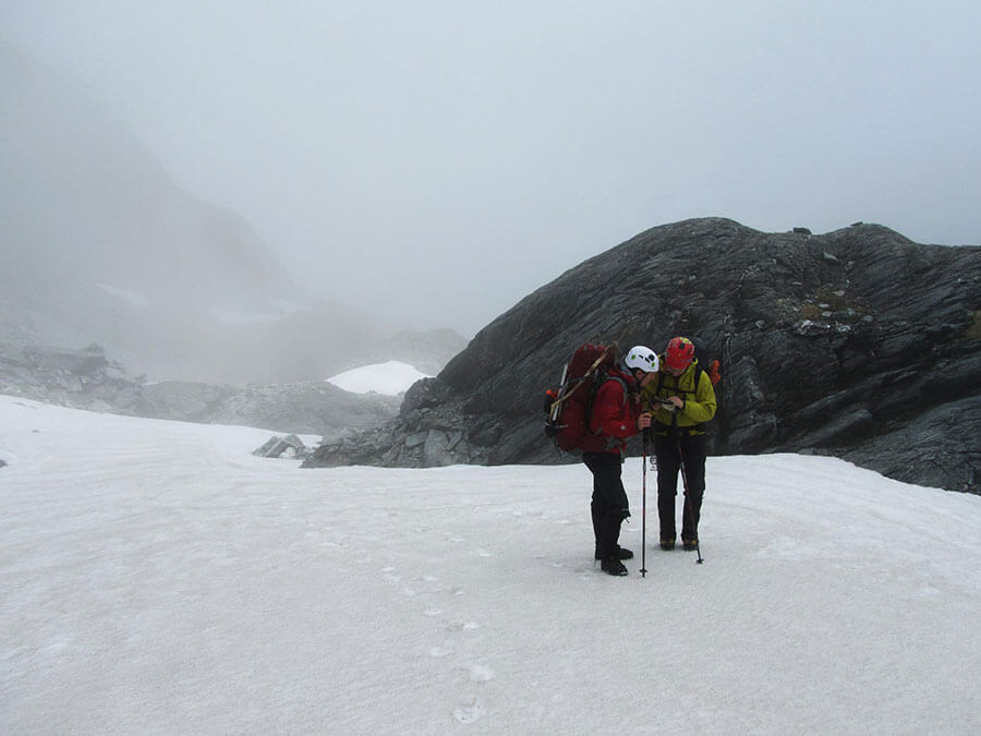 Checking the map in one of many whiteouts of the day.