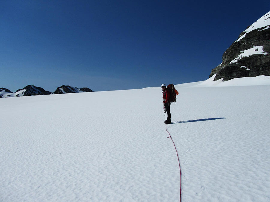 Matthew Dickinson and blue skies on a quick explore in the direction of Snowy Peak (2376m).