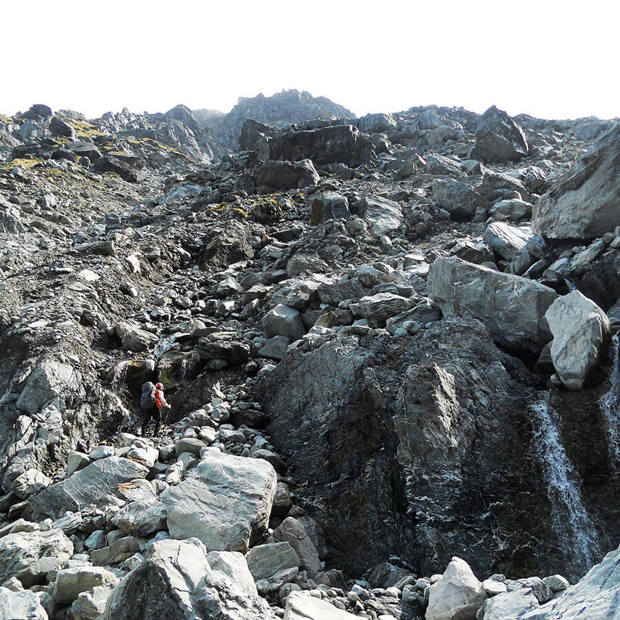 Climbing back up towards the saddle, surrounded by huge boulders.